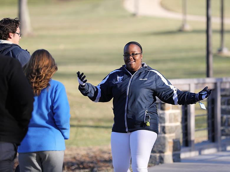 Female student giving campus tour.